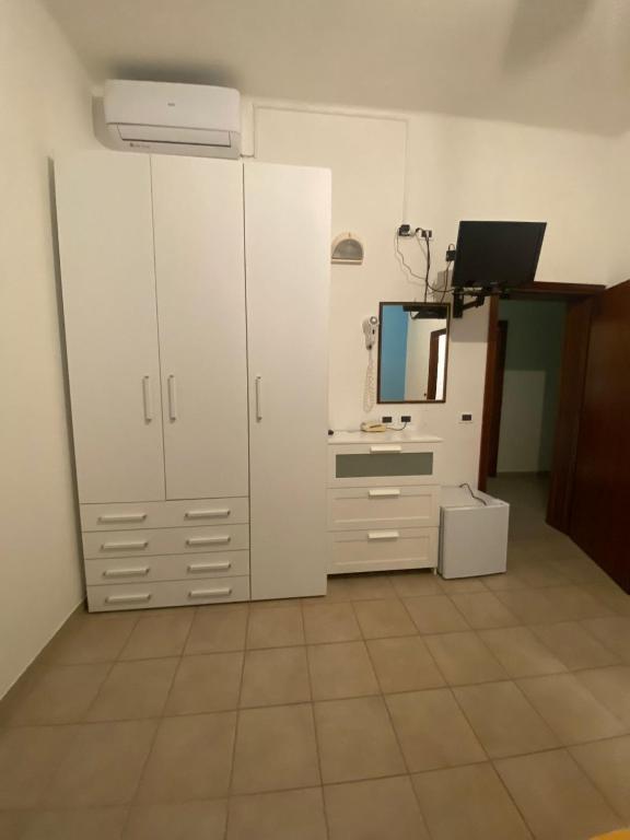 Kuchyň nebo kuchyňský kout v ubytování Hotel Gladys