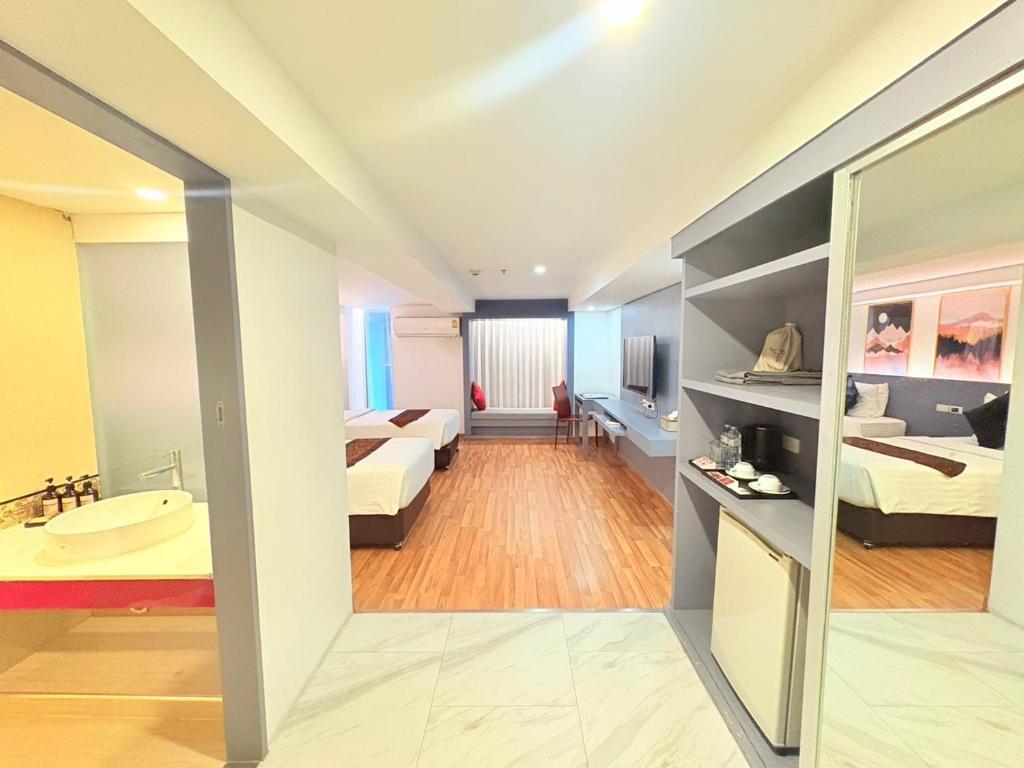 Postel nebo postele na pokoji v ubytování I Residence Hotel Silom