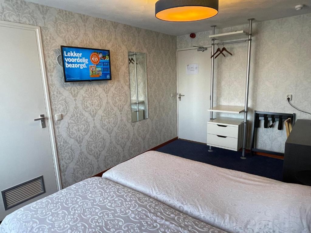 Voodi või voodid majutusasutuse Hotel DeWaag Makkum toas