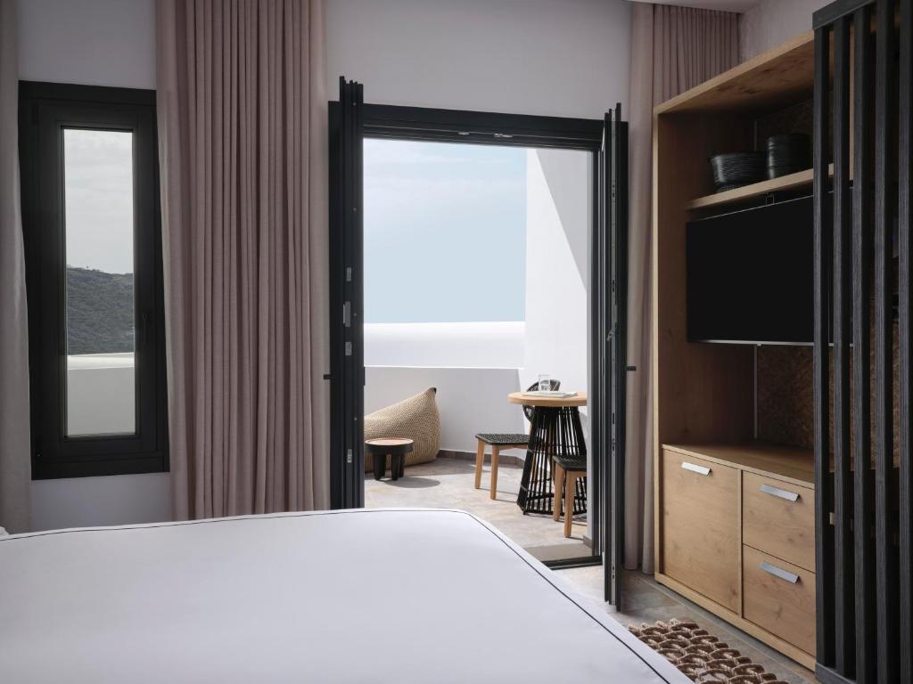 Postel nebo postele na pokoji v ubytování Kalea Mykonos