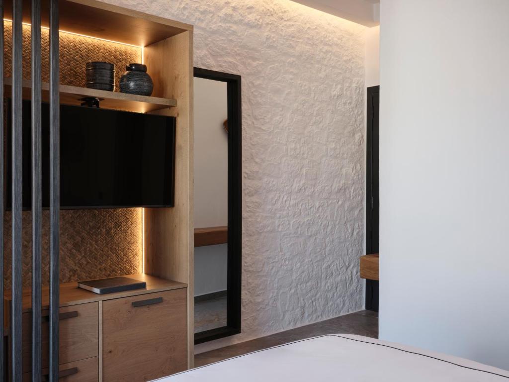 Postel nebo postele na pokoji v ubytování Kalea Mykonos