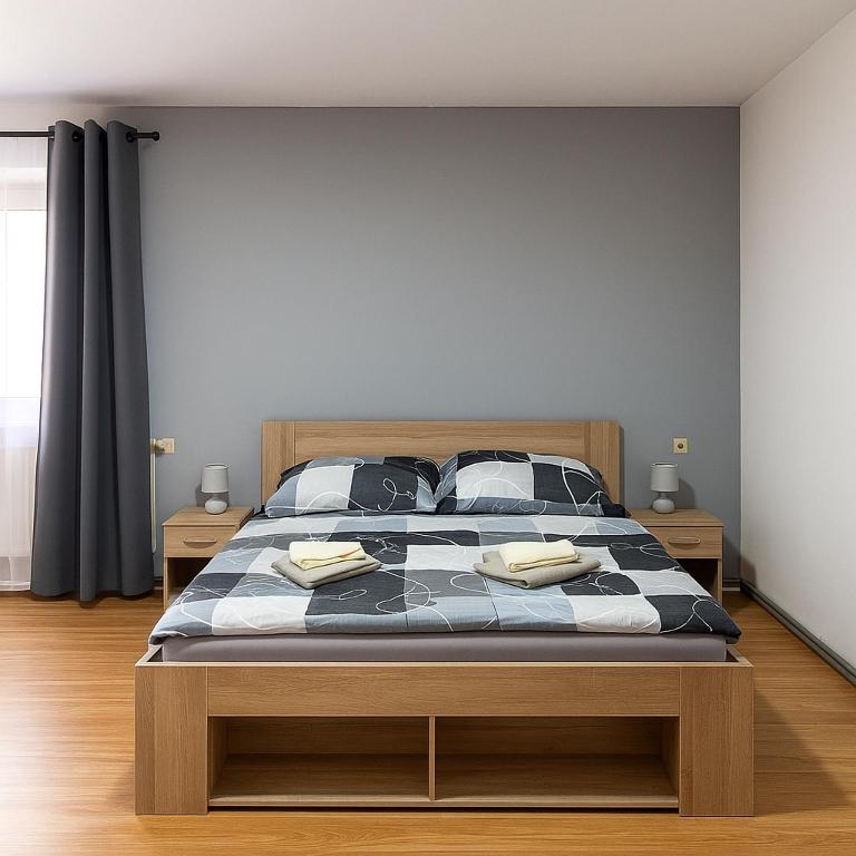 Postel nebo postele na pokoji v ubytování Apartmány Sport