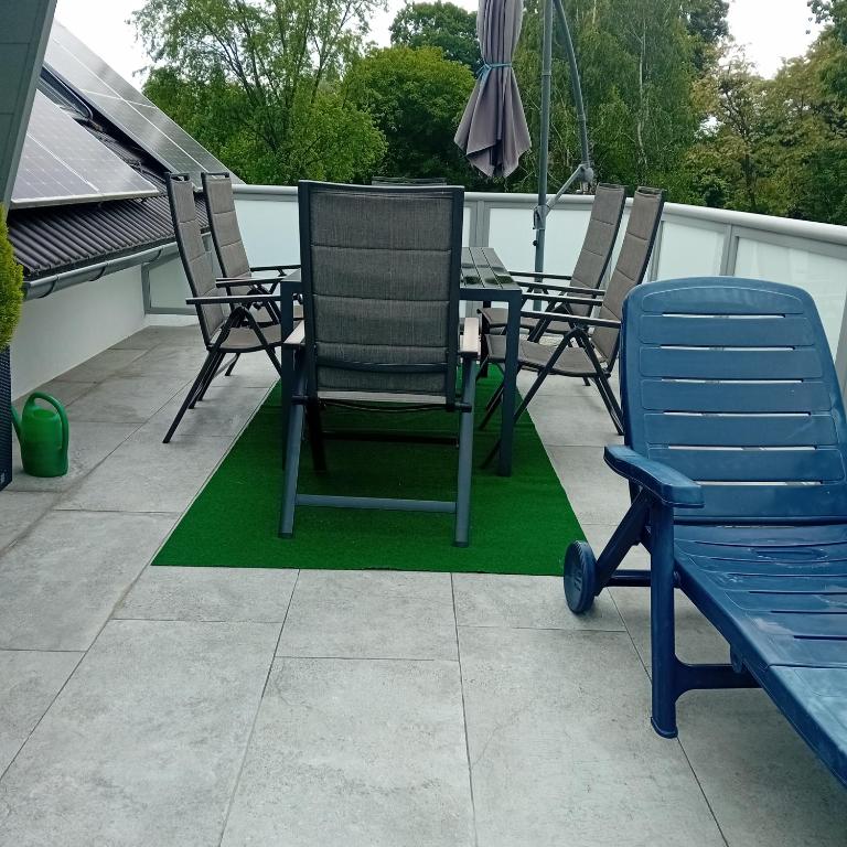 a group of chairs and a table on a patio at Steggasse1 in Oberschützen