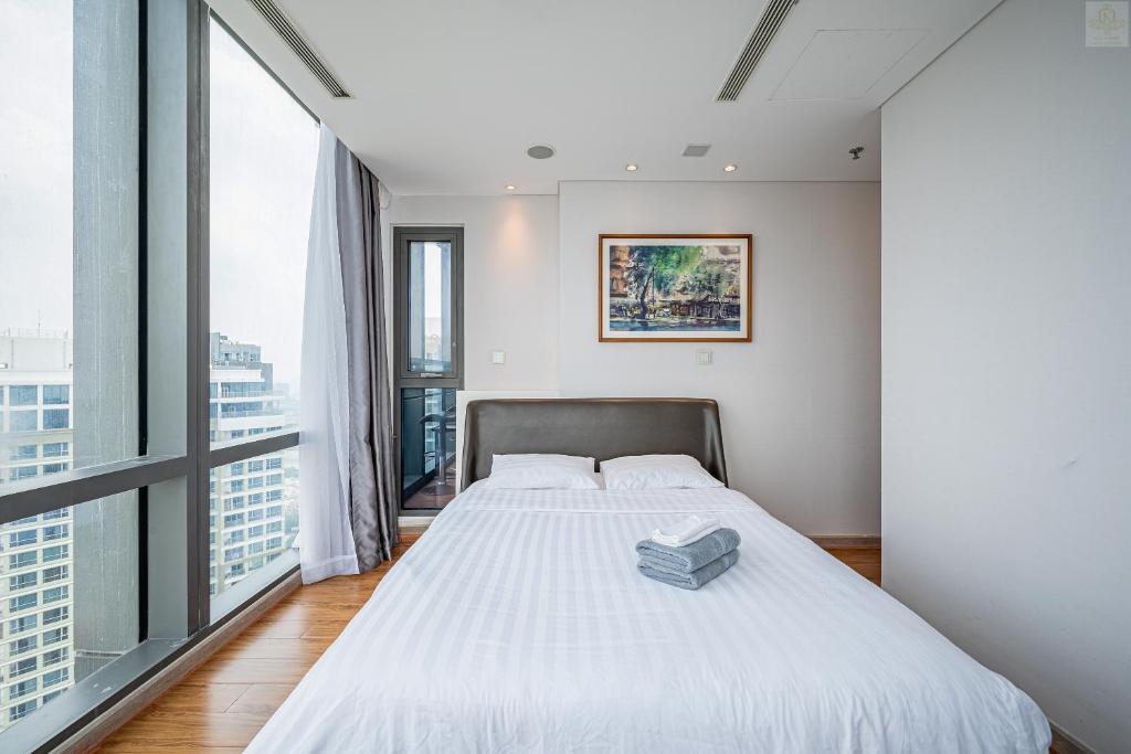 Postel nebo postele na pokoji v ubytování The Landmark 81 Riverside Resident Suite