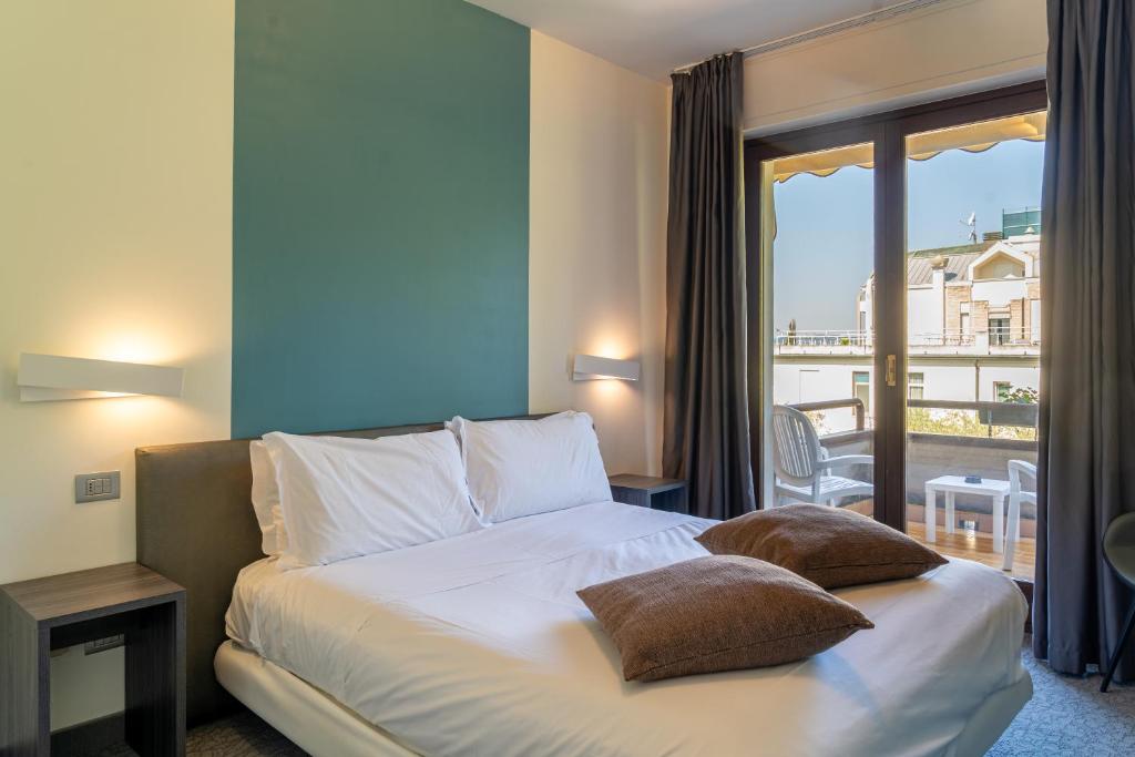 Postel nebo postele na pokoji v ubytování Hotel Désirée - Garda Lake Collection