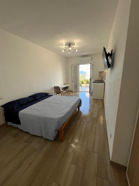 En eller flere senge i et værelse på Casa Ginestra