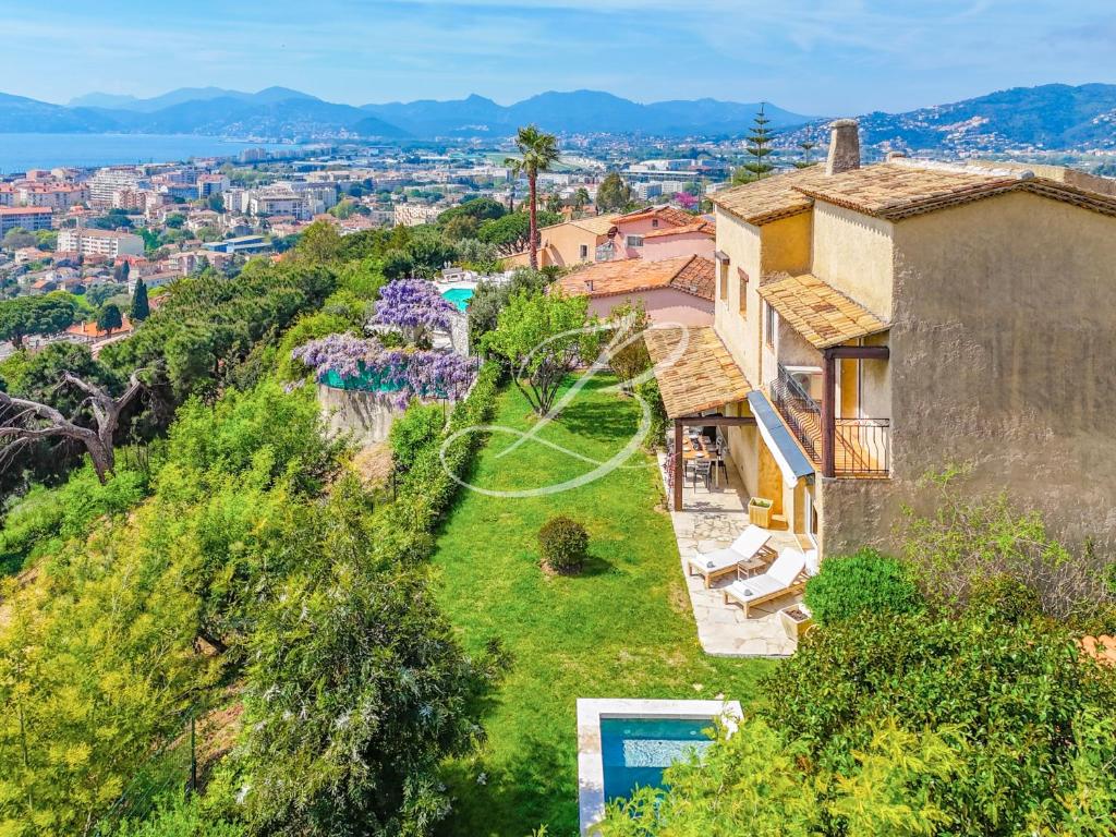 an aerial view of a house on a hill at Villa Blue Horizon - Panoramic Pools Cannes in Cannes