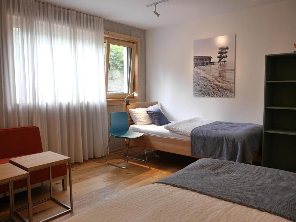 Ένα ή περισσότερα κρεβάτια σε δωμάτιο στο Ammersee Lodge