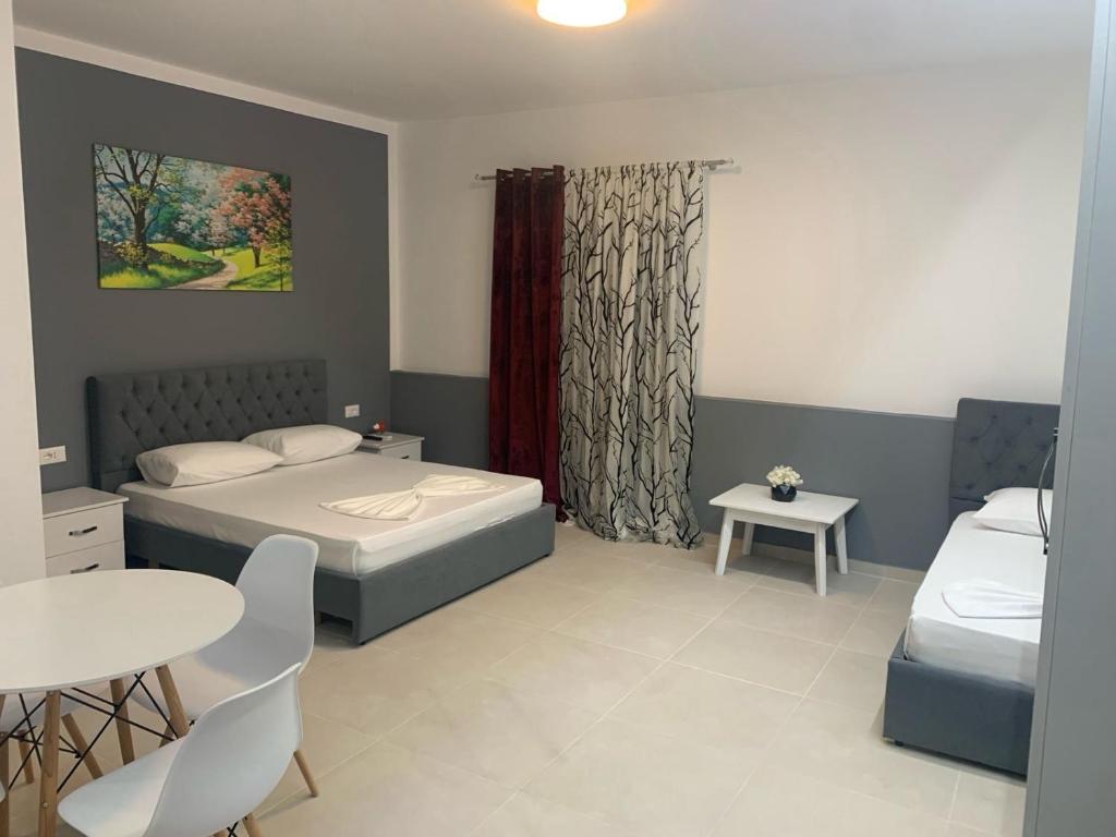 Cama ou camas em um quarto em Vila Topi