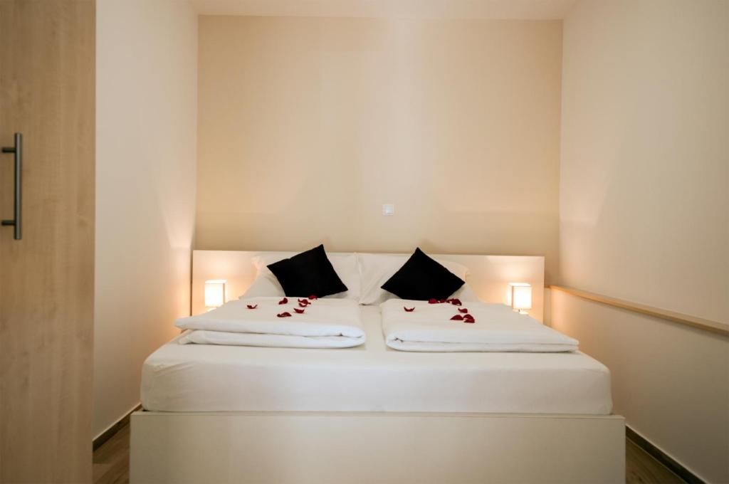 Postel nebo postele na pokoji v ubytování Guest House Bulevar