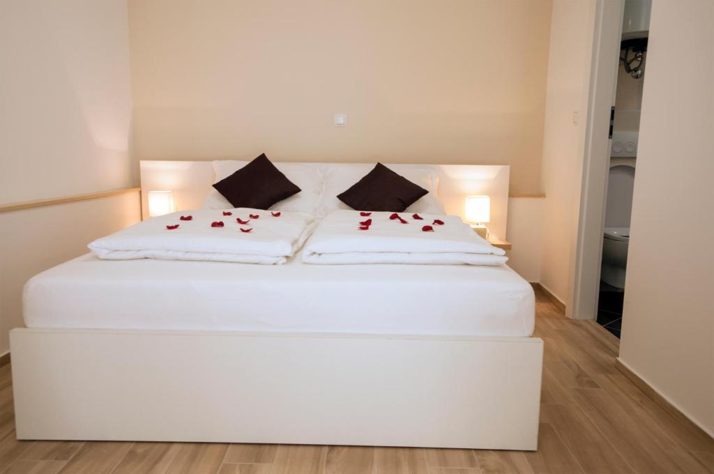 Postel nebo postele na pokoji v ubytování Guest House Bulevar
