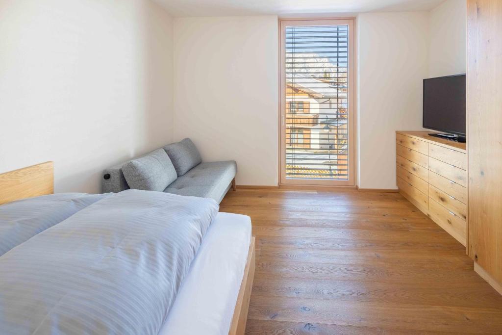 A bed or beds in a room at Krone Apartments Schruns, Top 6/7/8