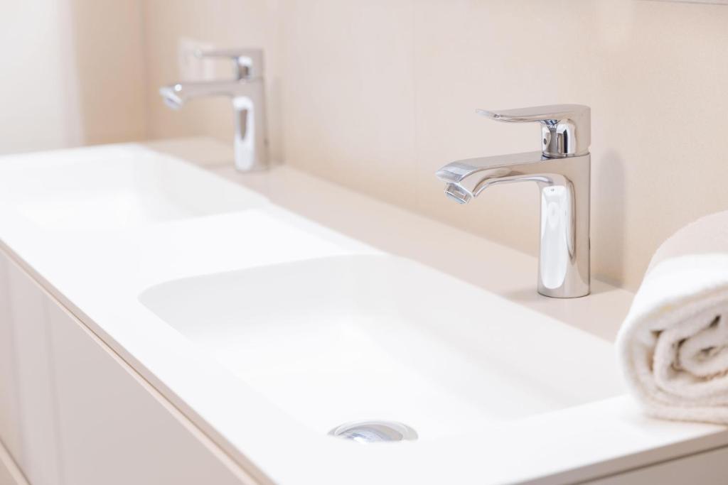 A bathroom at Krone Apartments Schruns, Top 6/7/8
