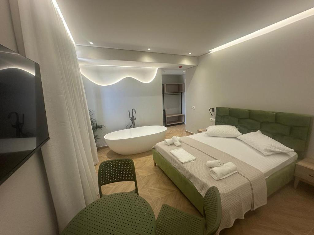 Postel nebo postele na pokoji v ubytování Hotel Parid