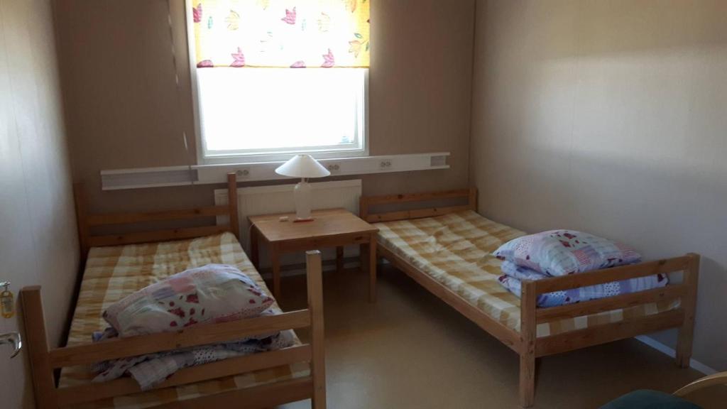 Postel nebo postele na pokoji v ubytování Täljebo Vandrarhem, Sundsbrovägen 1, Söderhamn
