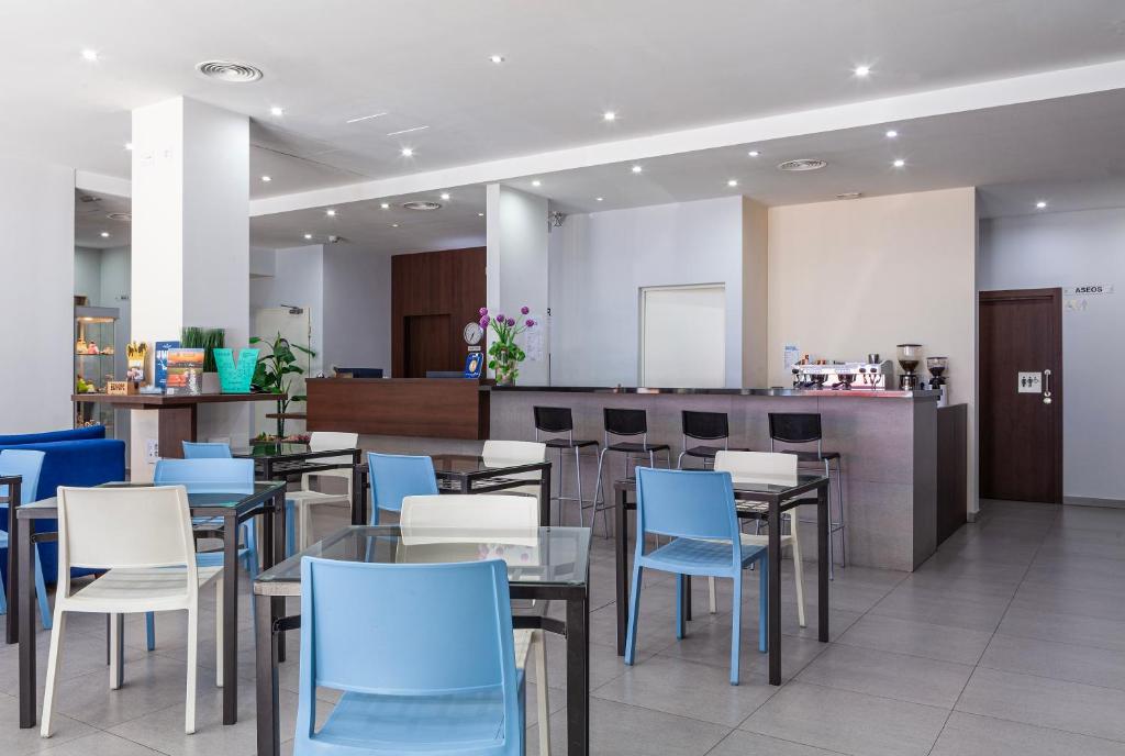Restaurace v ubytování Hotel Olympia Universidades