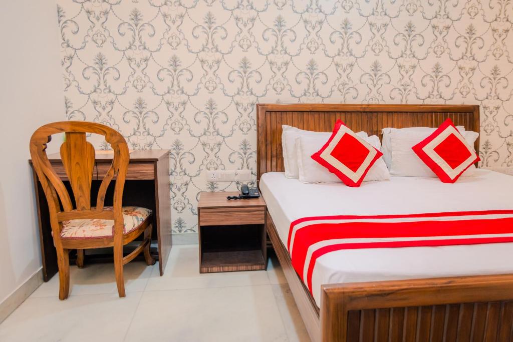 Postel nebo postele na pokoji v ubytování Peepal Tree Residency