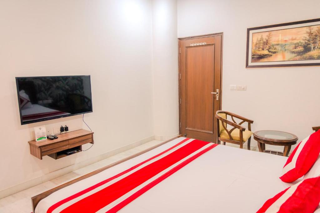 TV a/nebo společenská místnost v ubytování Peepal Tree Residency