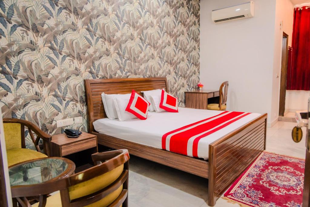 Postel nebo postele na pokoji v ubytování Peepal Tree Residency