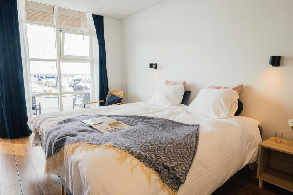Postel nebo postele na pokoji v ubytování Fridas Hotell