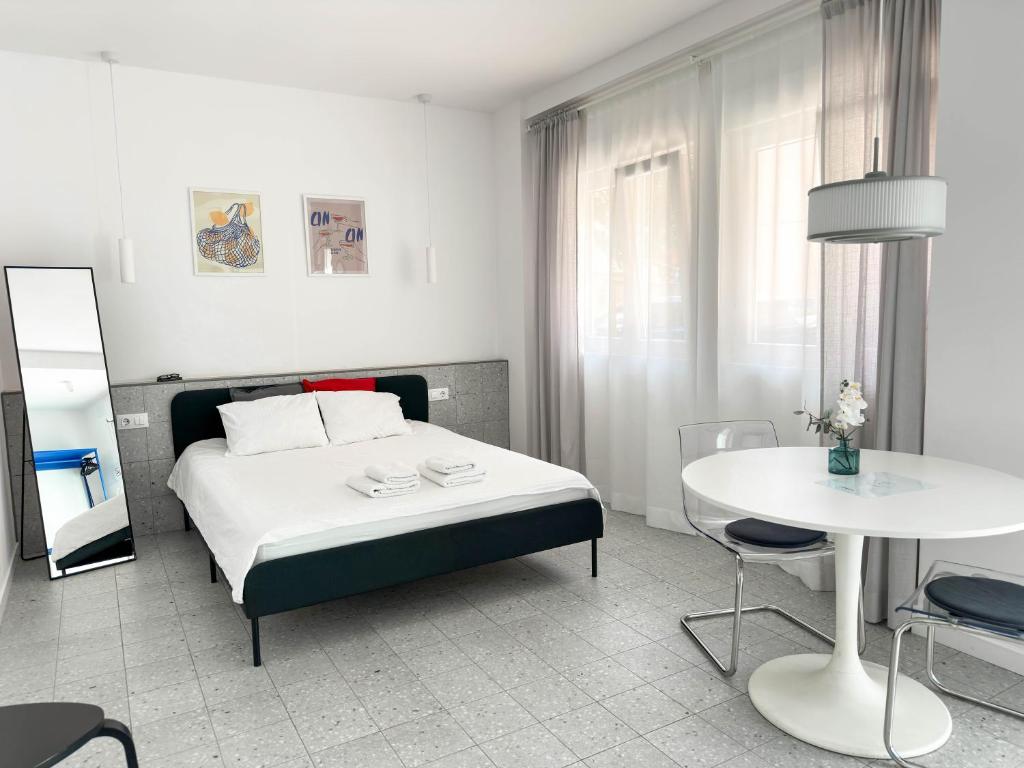 Postel nebo postele na pokoji v ubytování Apartamentos Navío