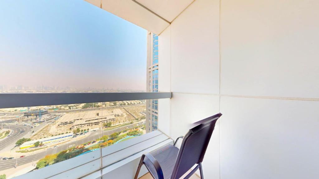 a room with a window with a view of a city at Modern 1BR in Saba Tower 2 - Prime JLT Location in Dubai