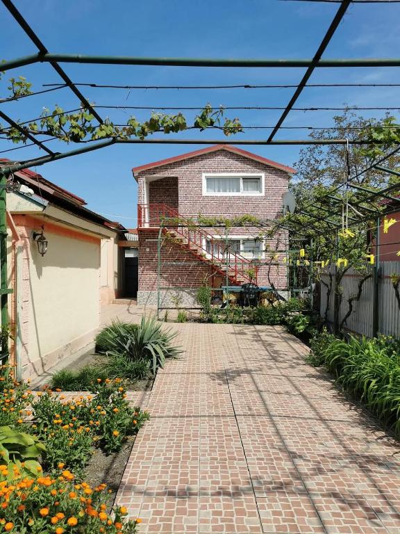 a brick walkway in front of a house at Casa Ramona Sulina in Sulina