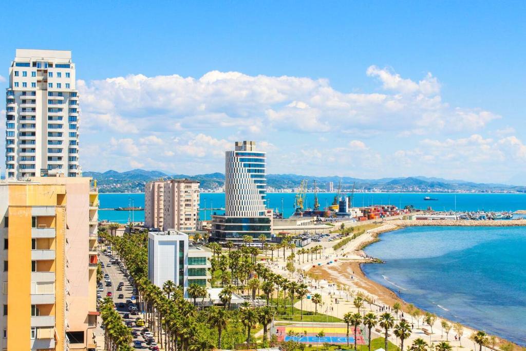 a city with a beach and buildings and the ocean at Casa del Mar 2 in Durrës