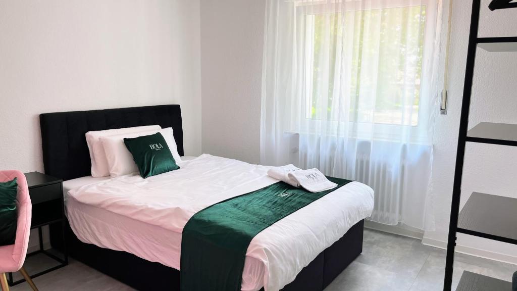 Postel nebo postele na pokoji v ubytování Hola Hotel Stuttgart