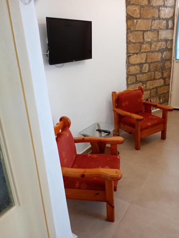 TV a/nebo společenská místnost v ubytování Gaios Rest Apartment Comfort Location Paxos Hospitality