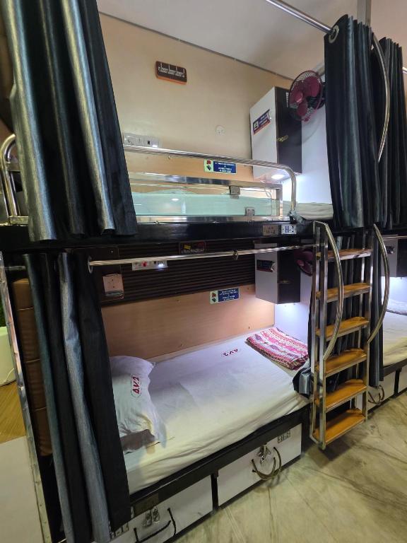Postel nebo postele na pokoji v ubytování AV Dormitory