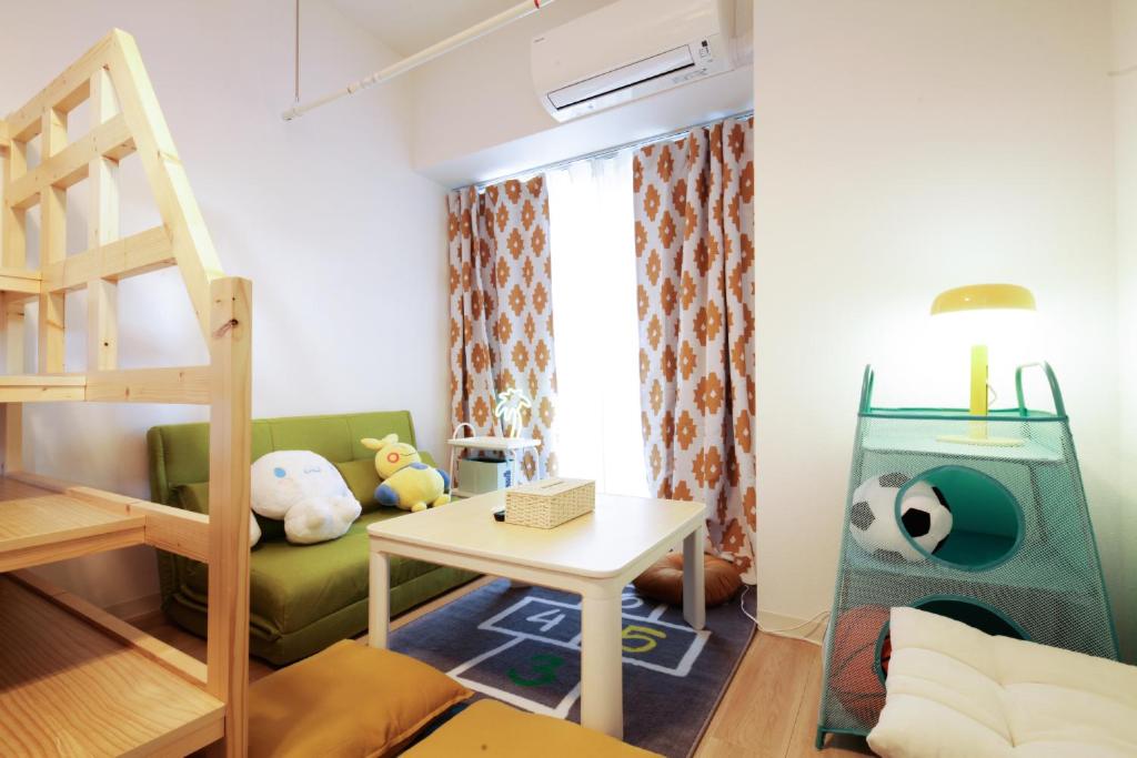 Postel nebo postele na pokoji v ubytování Suke Home Oshiage