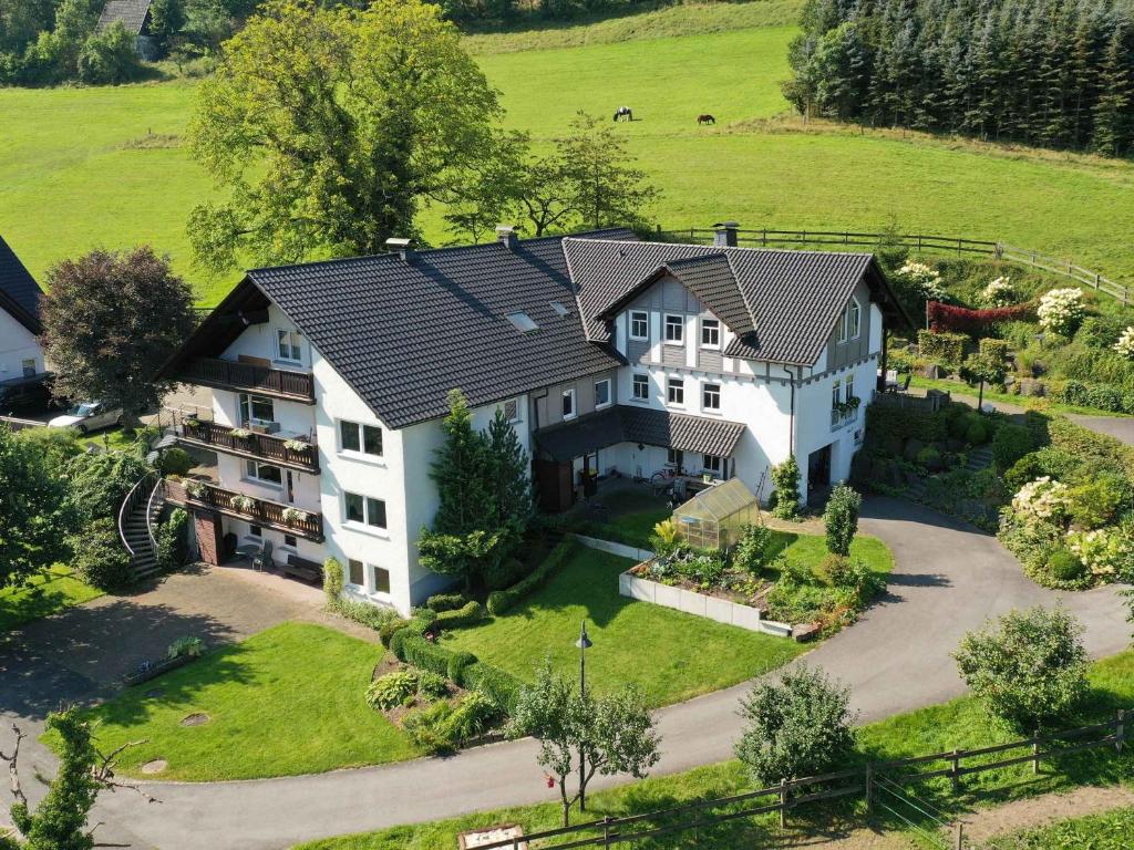 an aerial view of a large house at Ferienwohnungen Familie Schauerte in Schmallenberg