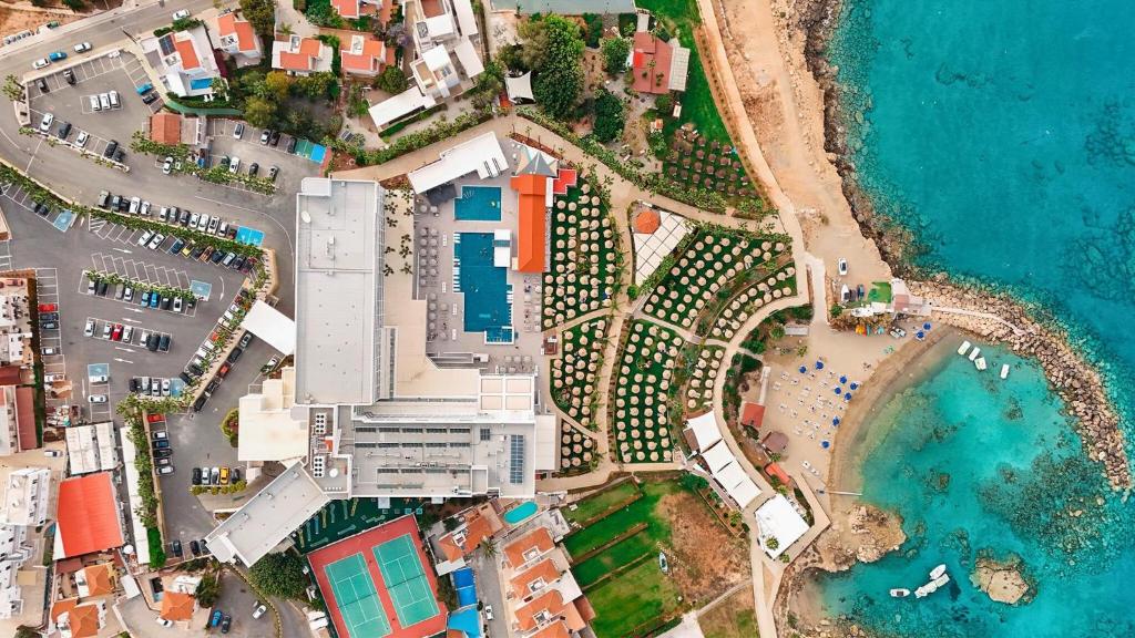 an overhead view of a beach and the ocean at Cavo Maris Beach Hotel in Protaras