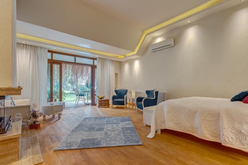 Postel nebo postele na pokoji v ubytování Olympos Lodge