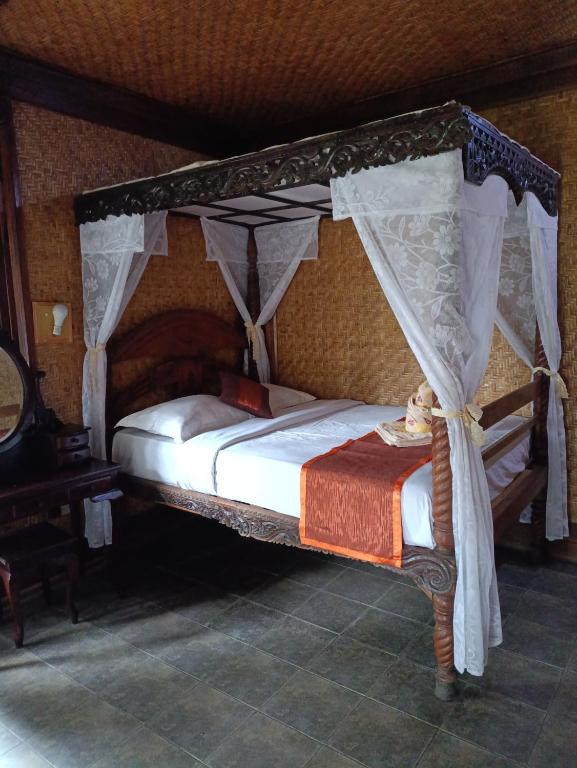 Postel nebo postele na pokoji v ubytování Yoschi's Hotel Bromo