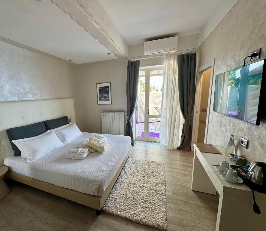 Postel nebo postele na pokoji v ubytování Esprit D'Hotel Panoramico