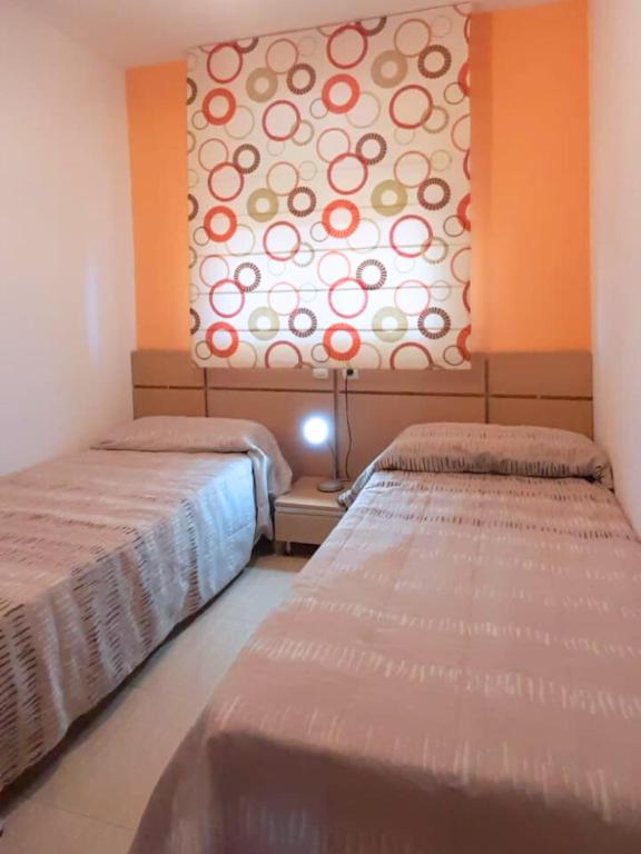 Postel nebo postele na pokoji v ubytování Playa Coral II 3 Nº 1054