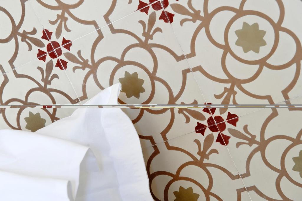 Postel nebo postele na pokoji v ubytování Relais Parco Cavalonga
