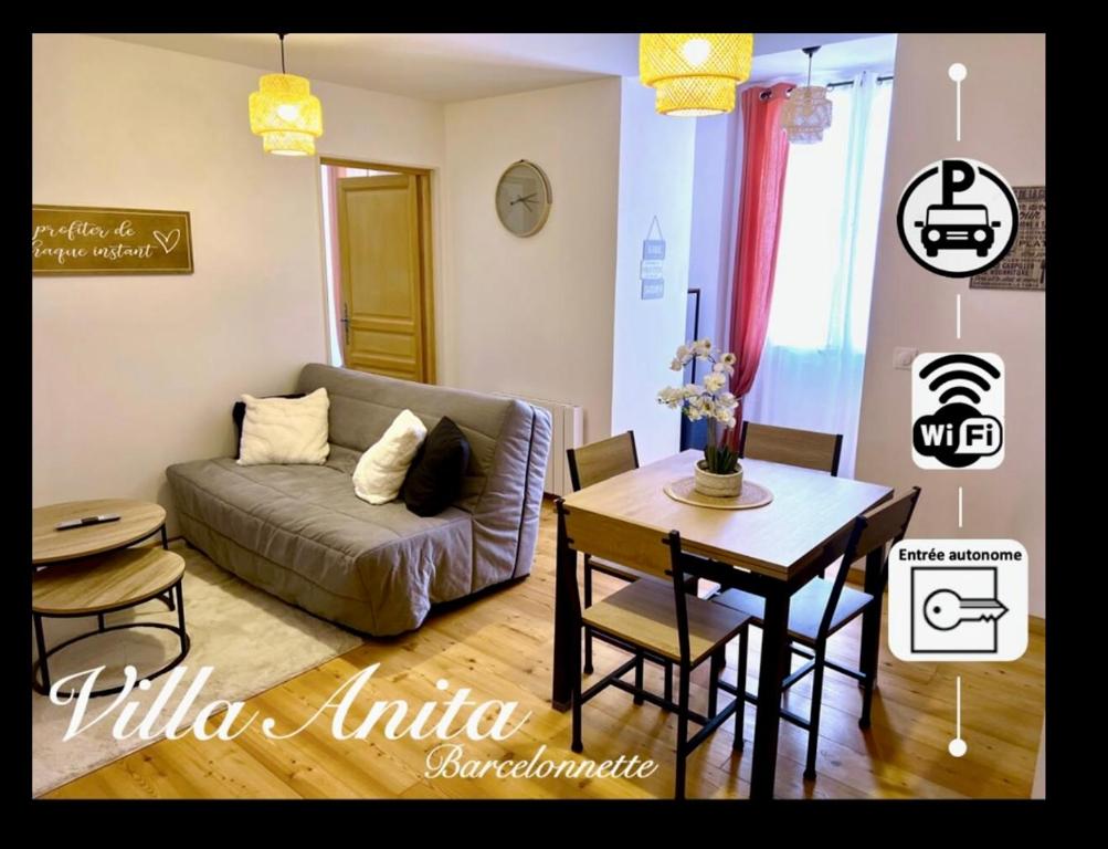 a living room with a couch and a table at Villa Anita -centre ville -parking privé -wifi in Barcelonnette