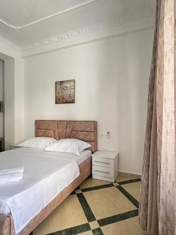 Postel nebo postele na pokoji v ubytování LM Murati Hotel
