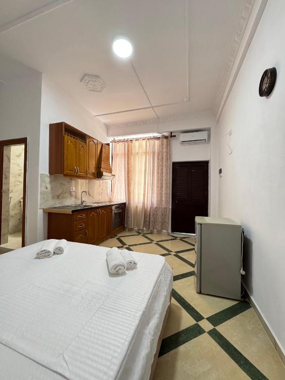 Postel nebo postele na pokoji v ubytování LM Murati Hotel