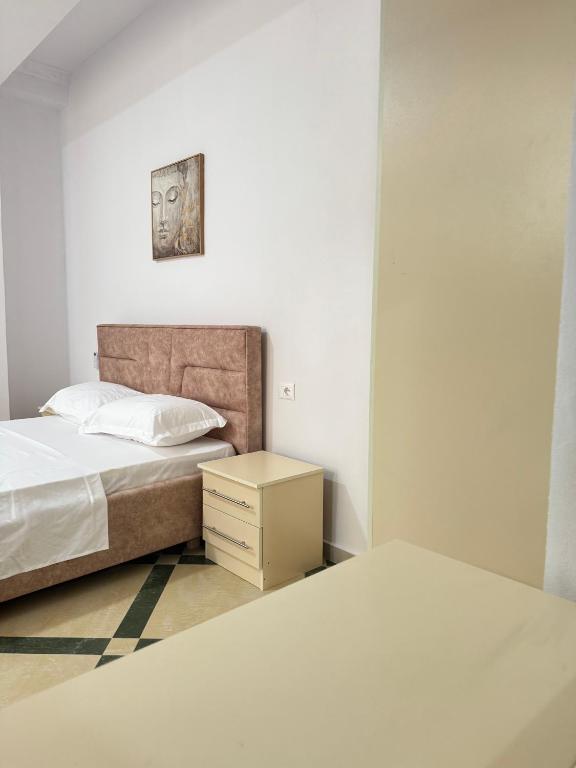 Postel nebo postele na pokoji v ubytování LM Murati Hotel
