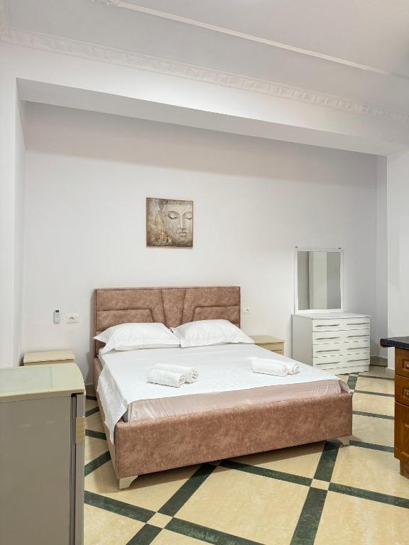 Postel nebo postele na pokoji v ubytování LM Murati Hotel