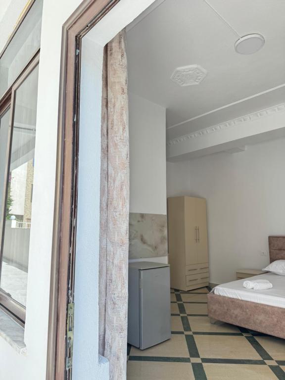 Postel nebo postele na pokoji v ubytování LM Murati Hotel