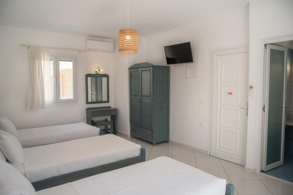 Postel nebo postele na pokoji v ubytování Ikaros Studios & Apartments
