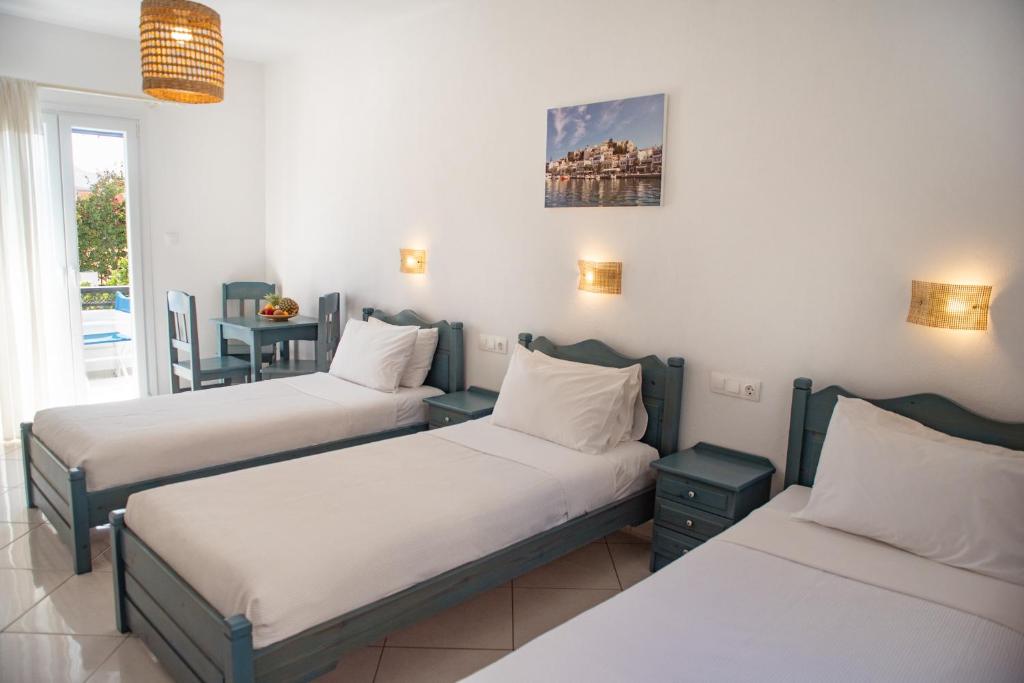Postel nebo postele na pokoji v ubytování Ikaros Studios & Apartments