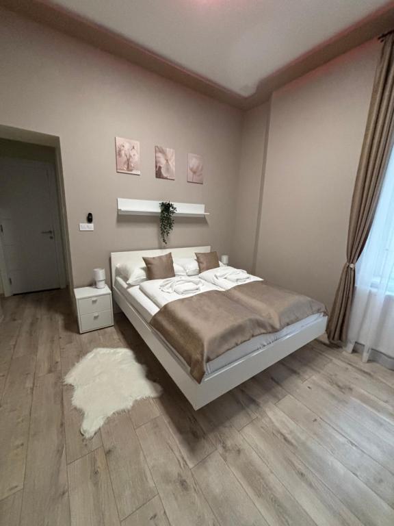 Postel nebo postele na pokoji v ubytování Partium Hotel Szeged