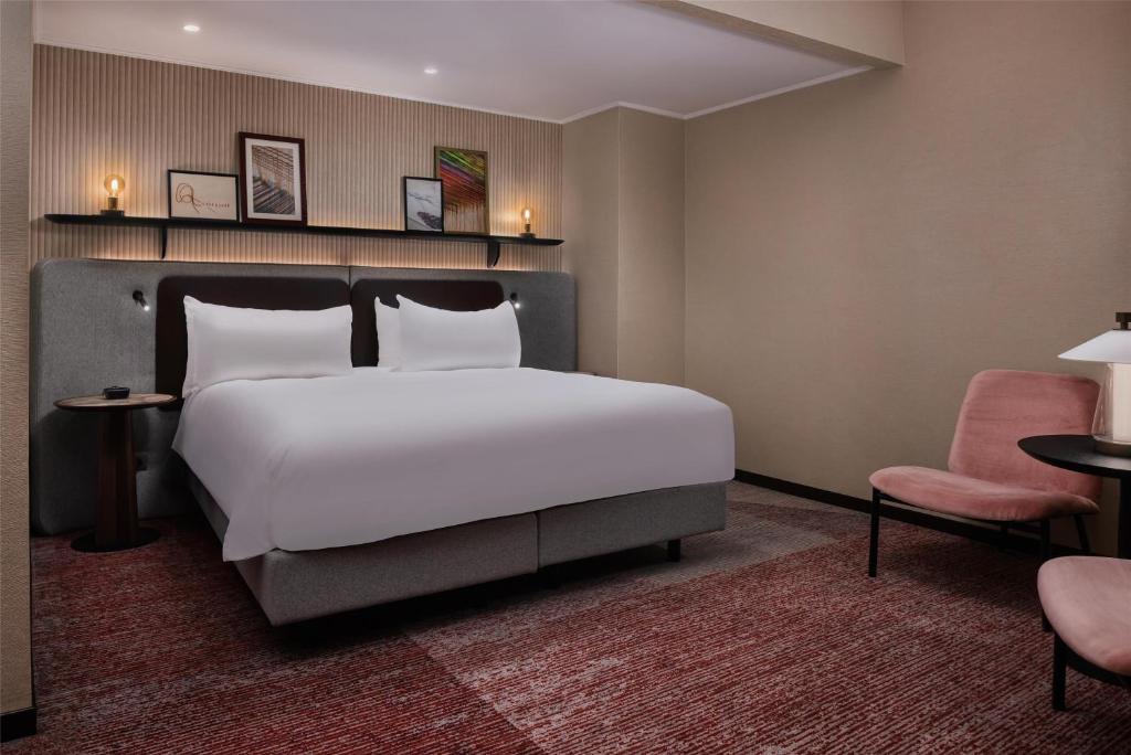 Postel nebo postele na pokoji v ubytování Hilton Milan
