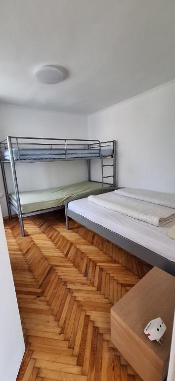 Postel nebo postele na pokoji v ubytování LiMa Apartman Ház